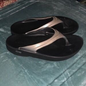 OOFOS Black and Metallic Sandals